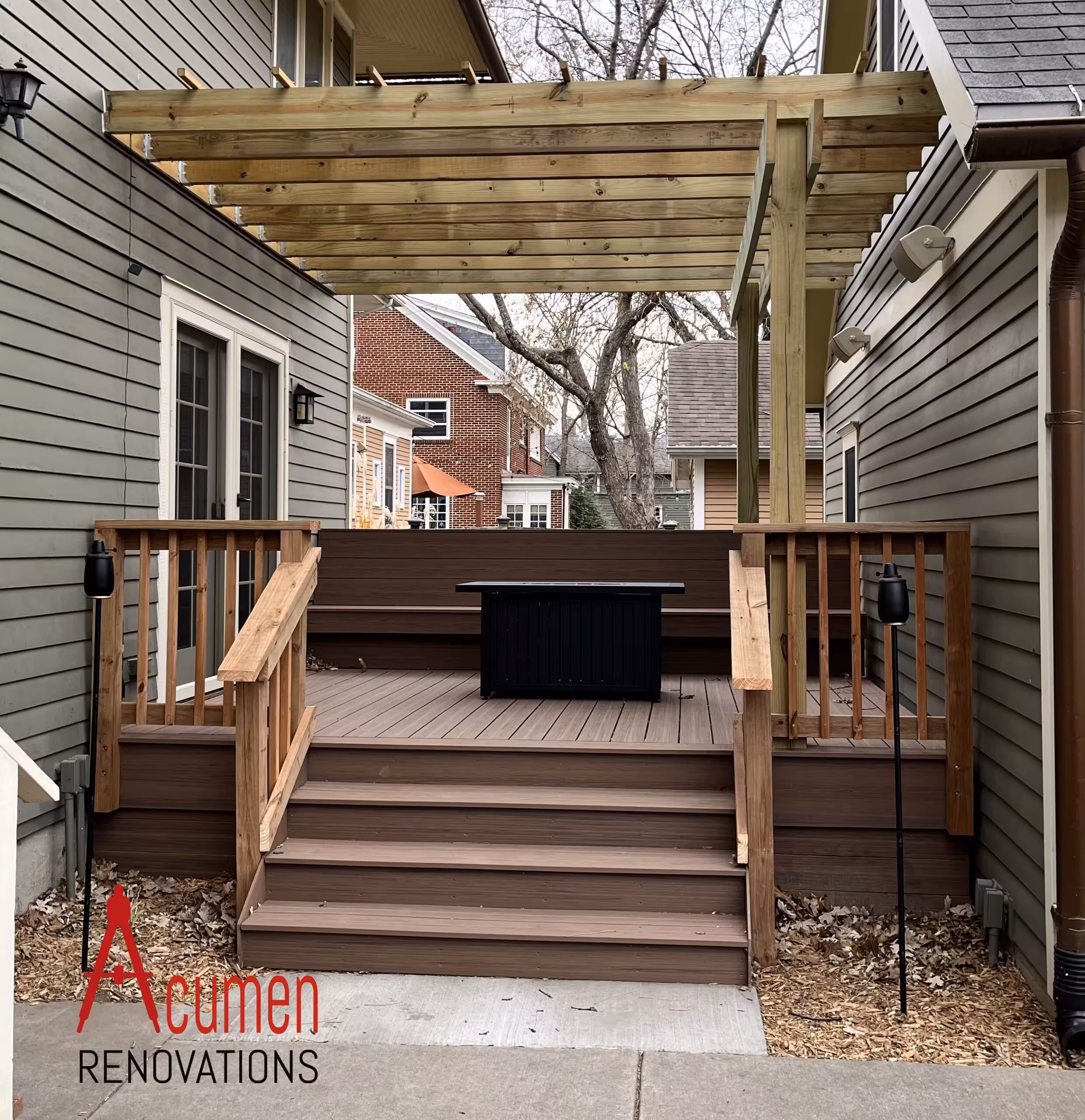Wood pergola built over a composite deck with integrated lighting by Acumen Renovations in Kansas City
